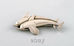 Sterling silver brooch by Georg Jensen. Design number 311. Two dolphins